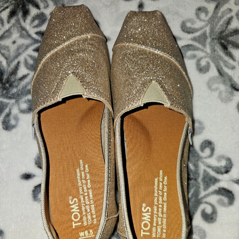 Toms Sparkly Gold Slip Ons